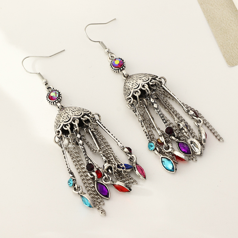 Bohemian Style Retro Long Dripping Oil Tassel Ethnic Hollow Bell Earrings display picture 10