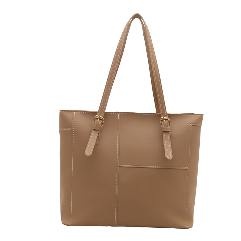 Bolsa de mujer de gran capacidad de textura de viaje de primavera 2025, nuevo bolso de hombro retro empalmado bolso de brazo portátil