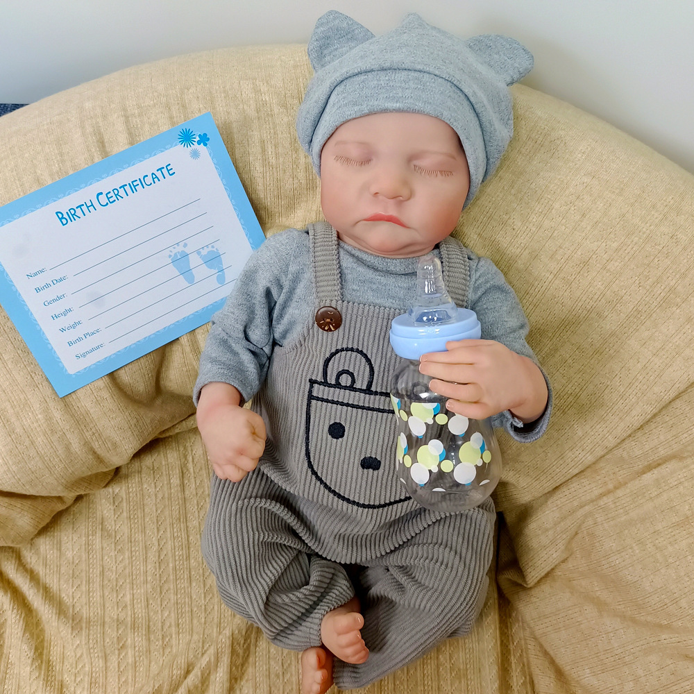 Muñeca de goma suave para bebés generación de inventario pesado pintado 18 pura muñeca hecha a mano de una pulgada de cuerpo cerrado ojos