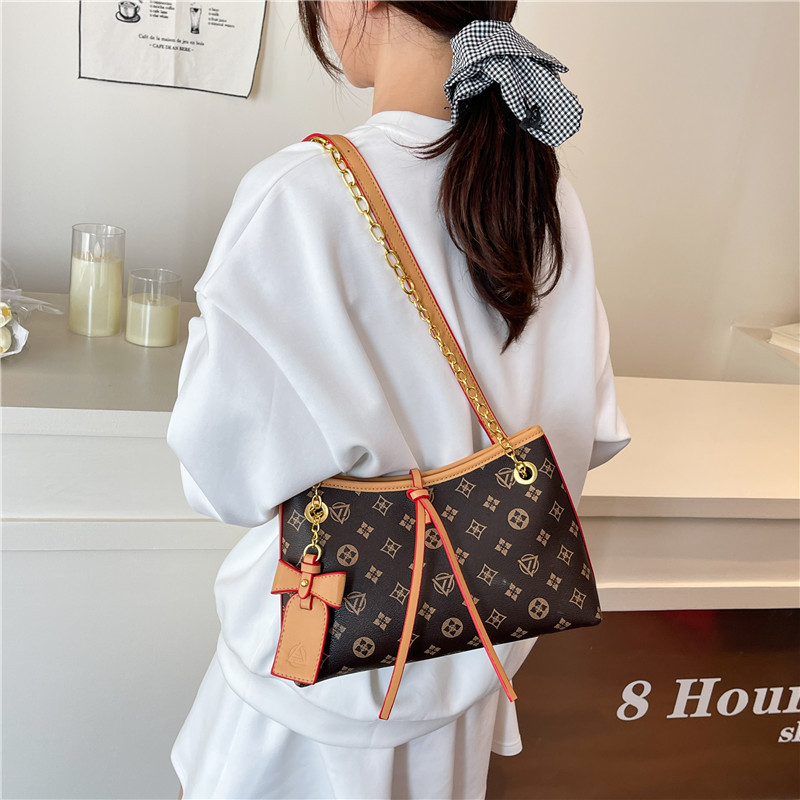 Bolso de cadena de textura transfronteriza 2025 verano nuevo bolso femenino retro bowknot bandolera moda contraste color bandolera