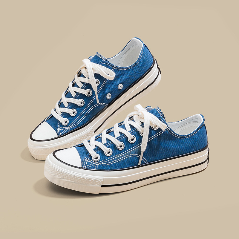 Zapatos de lona de tacón plano de mujer explosión baja estilo de moda coreano versátil estilo clásico retro nicho diseño zapatos de lona blancos image 10