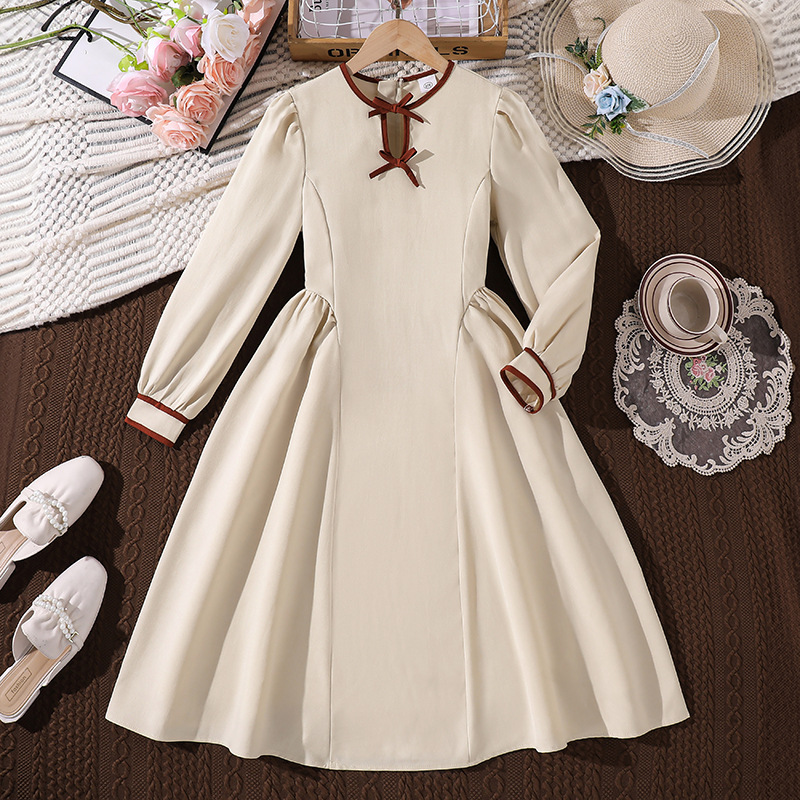 Ropa infantil transfronteriza 2026 otoño nuevo estilo de princesa francesa estilo de color sólido delgado empalme vestido grande explosión