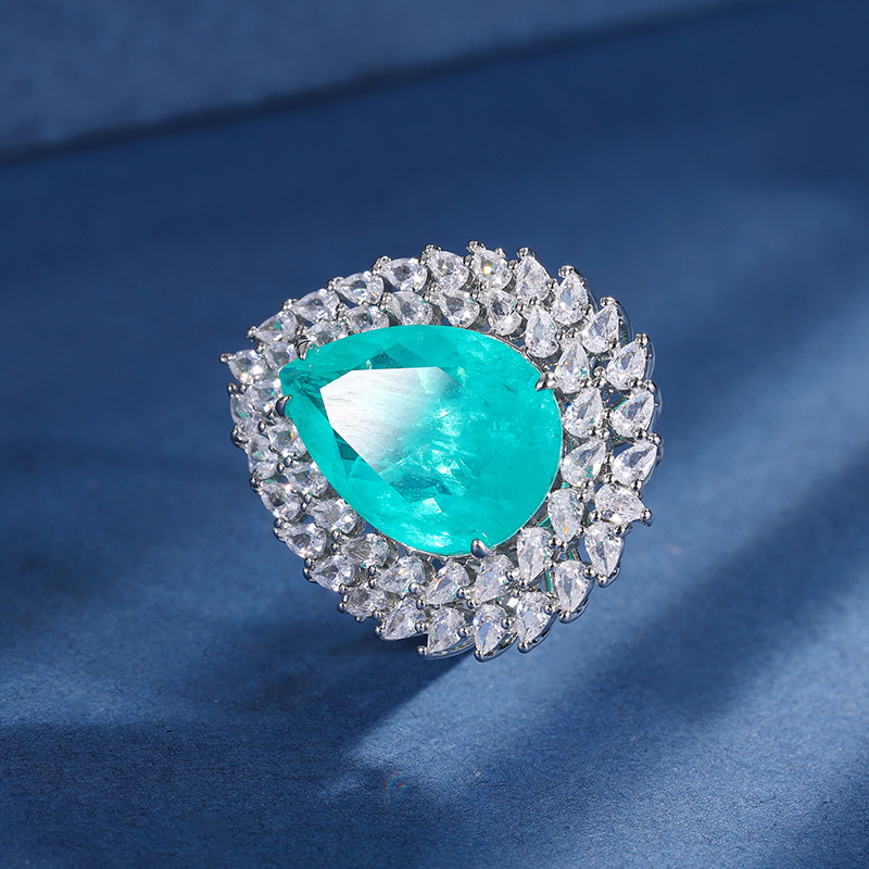 Zhuang Sheng joyería cobre inferior oro plateado traje europeo y americano simulación color tesoro gota de agua diamante anillo colgante 13*18