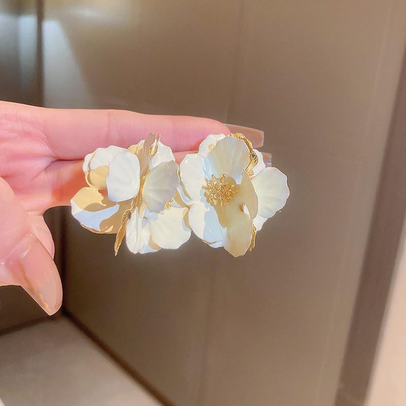 Aguja de plata flor pendientes geométricos pendientes dulces pequeños frescos de Corea del Sur ins moda nicho pendientes