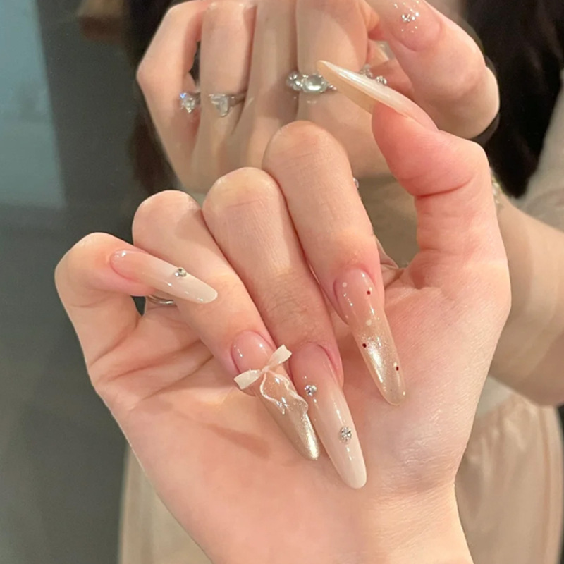 Long, delicate, and cute nail art with a 3D bow and red polka dot design, pre-made false nails Long, delicate, and cute nail art with a 3D bow and red polka dot design, pre-made false nails