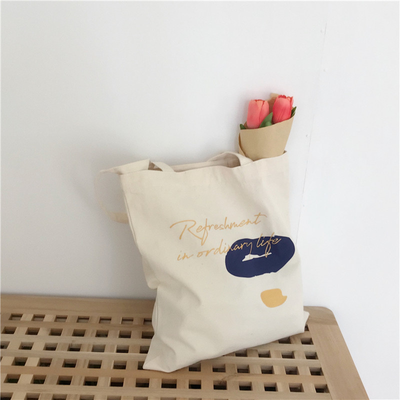 E131 canvas bag, Korean-style ins hand-held shoulder bag, color block letter graffiti shopping bag, female student's search for sources undefined
