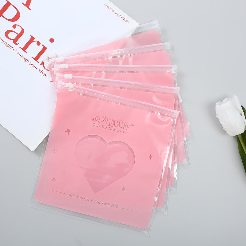 Bolsa con cremallera de ropa Bolsa con cremallera de crisantemo pequeño Bolsa de embalaje de camiseta Bolsa de ropa interior Bolsa de ropa PE esmerilada pequeña bolsa ziplock