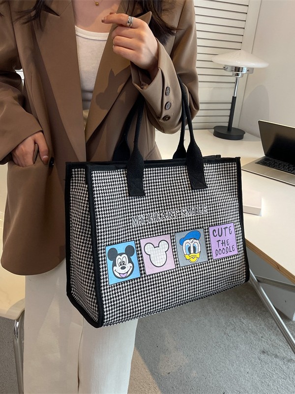 Bolso de mujer de alta sensación 2025 nuevo lienzo simple impresión de gran capacidad bolso de mano bolso de hombro de caricatura mamá