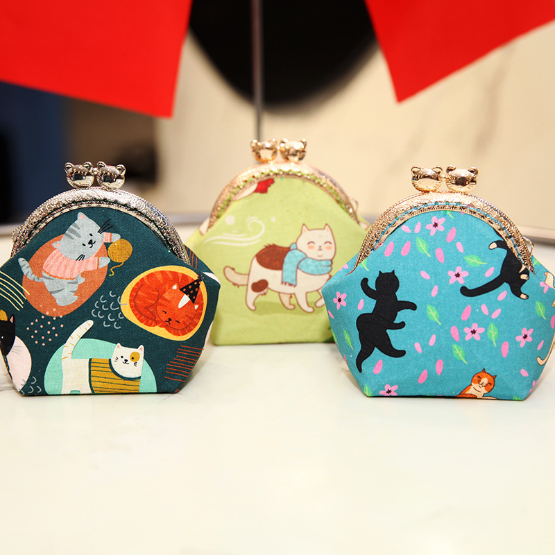 Bolsa de material de bordado bricolaje hecho a mano 8,5 boca Bolsa de Oro patchwork bolsa antigua bolsa transfronteriza inglés gato bolsa de almacenamiento