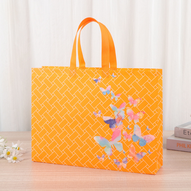 Bolso grueso de tela no tejida Bolso de compras de ropa no tejida para hombre Bolso de mano de regalo con impresión en color de película