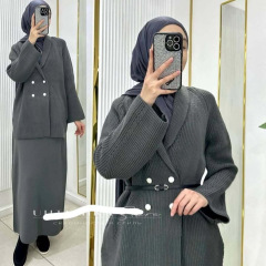 2025春の新型越境欧米の外国貿易の婦人服の長袖の純色のニットのボタンの半身のスカートのファッションのスーツ