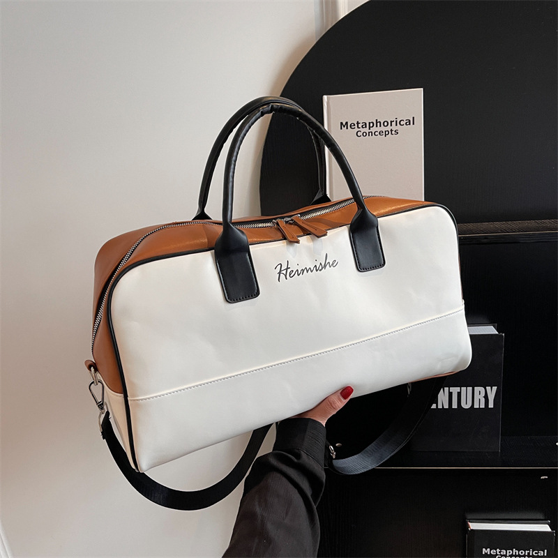 Bolsa de equipaje de gran capacidad de viaje de negocios de corta distancia Nueva bolsa de viaje de color de contraste de moda bolsa de almacenamiento de ropa portátil simple de un hombro