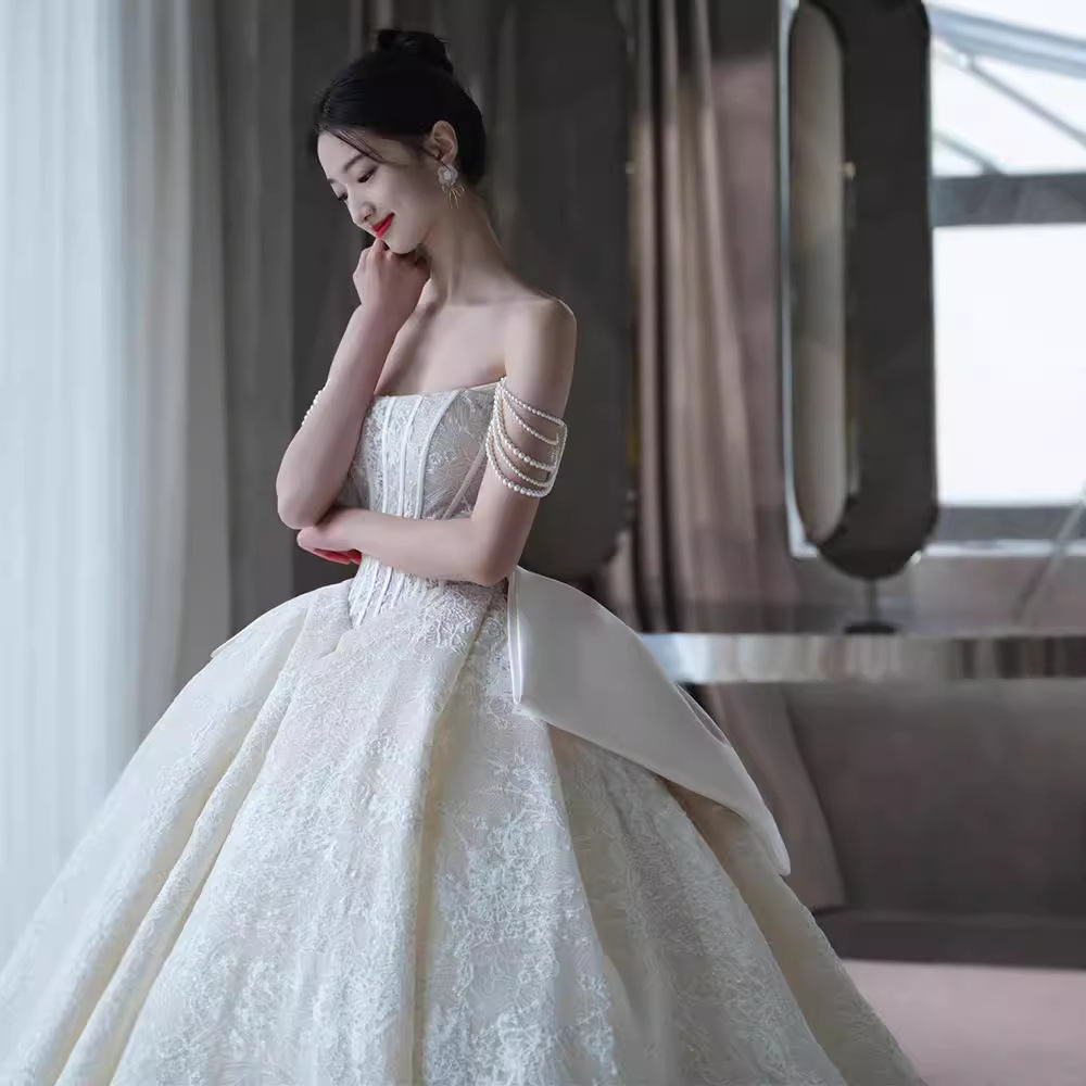 Vestido de novia sin tirantes, nuevo estilo 2026, estilo francés forestal, ligero, con textura vintage, adecuado para figuras pequeñas y de talla grande, con cola.