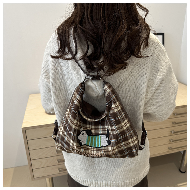 A new 2024 trendy and stylish backpack for women, featuring a cartoon checkered single-shoulder crossbody bag and a tote bag undefined