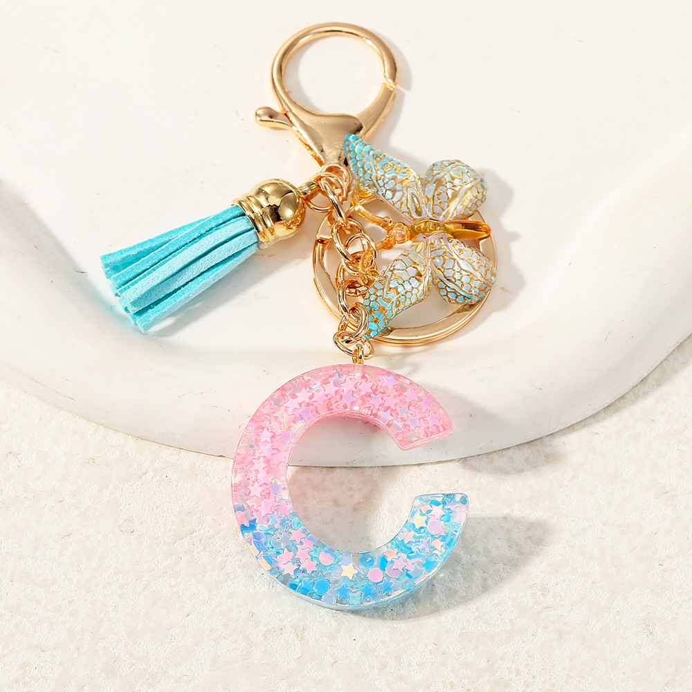 Europa y los Estados Unidos transfronterizos nuevos cristal sequinado goteo de goma letras inglesas joyería llavero y bolsos colgante apoyo al por mayor