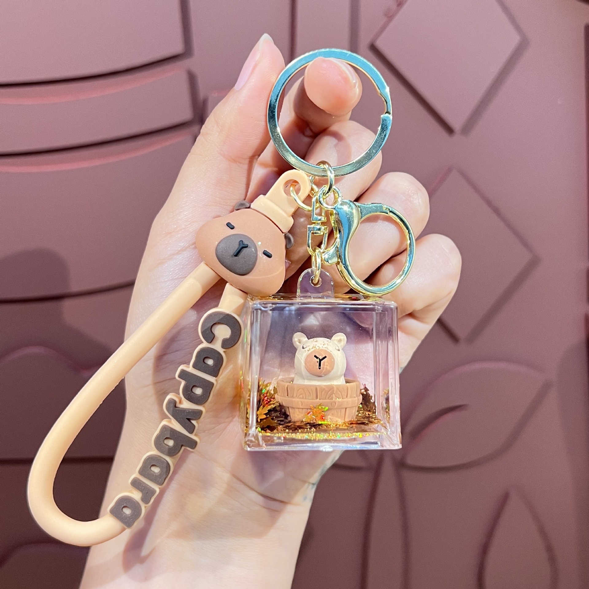 Botella creativa de aceite flotante Capibara Dolphin Keychain bolsos de automóviles exquisitos colgantes de arena flotante regalos al por mayor