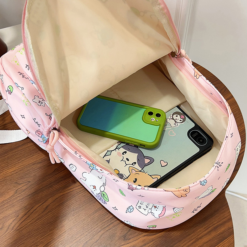 Mochila de graffiti de dibujos animados ligera, mochila de gran capacidad japonesa, mochila de estudiantes de escuela secundaria pequeña y fresca.
