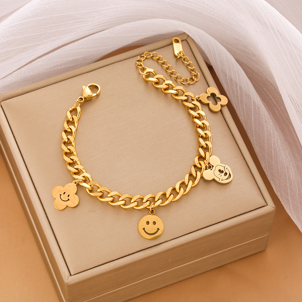 Pulsera de trébol de acero titanium vendedora caliente transfronteriza europea y americana con incrustaciones de concha pulsera colgante pulsera de diseño avanzado sin desvanecimiento al por mayor