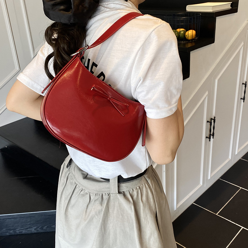 Nicho coreano de lujo ligero arco brazo bolso para mujeres 2025 nuevo estilo versátil bolso de hombro de estilo extranjero bolso de moda