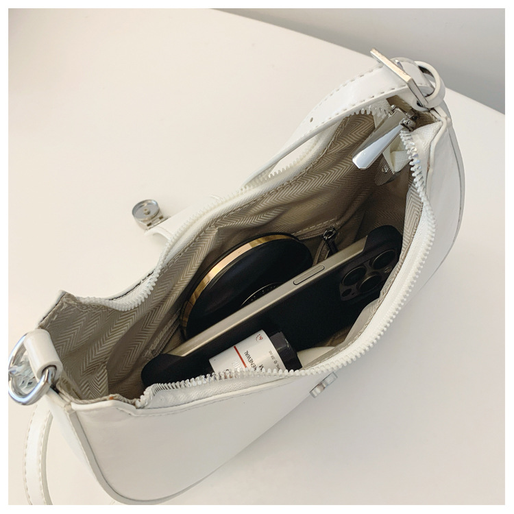 Bolsos de diseño de nicho de lujo ligero de alto nivel para mujeres 2024 nuevo temperamento de moda versátil bolso de hombro de una sola vez bolso de media luna