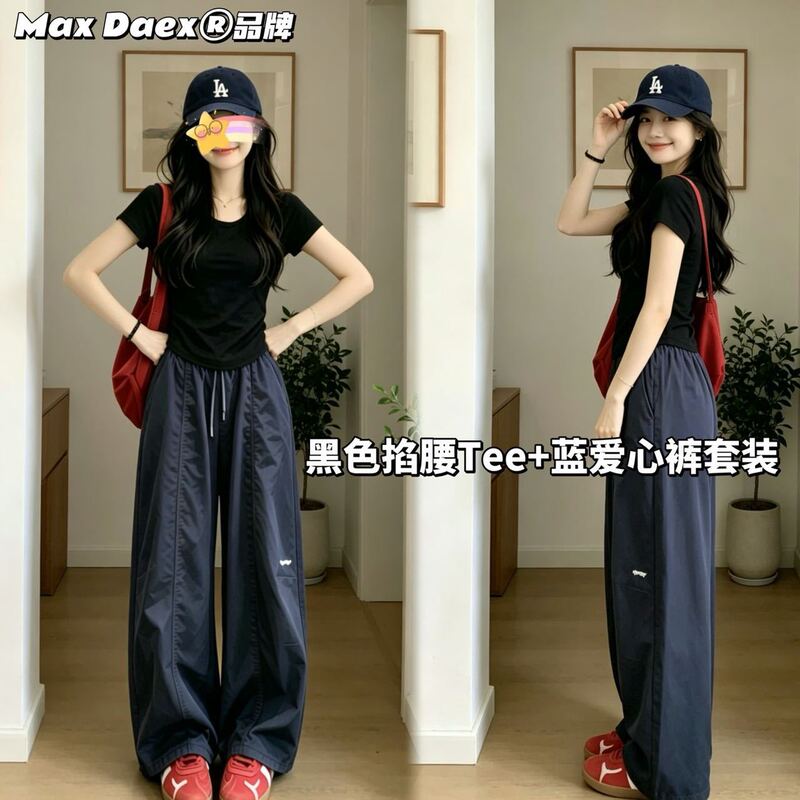Max Daex ® Black fitted T-shirt paired with blue heart-patterned pants makes for a complete summer sports outfit Max Daex ® Black fitted T-shirt paired with blue heart-patterned pants makes for a complete summer sports outfit