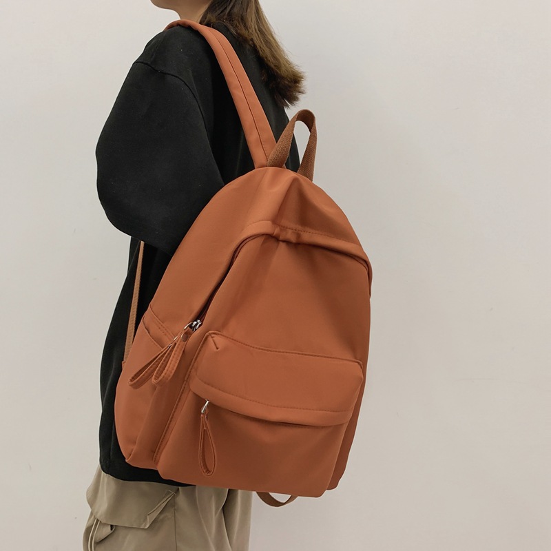 Venta al por mayor transfronteriza 2023 nueva mochila de pareja literaria de nailon simple y versátil mochila de escuela para estudiantes de gran capacidad