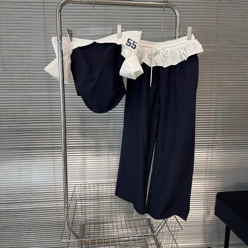 運動感の清純な衝突色の肩の上着のハスの葉の縁の曲がった刀のズボンの2セットの女性のデザイン感|undefined