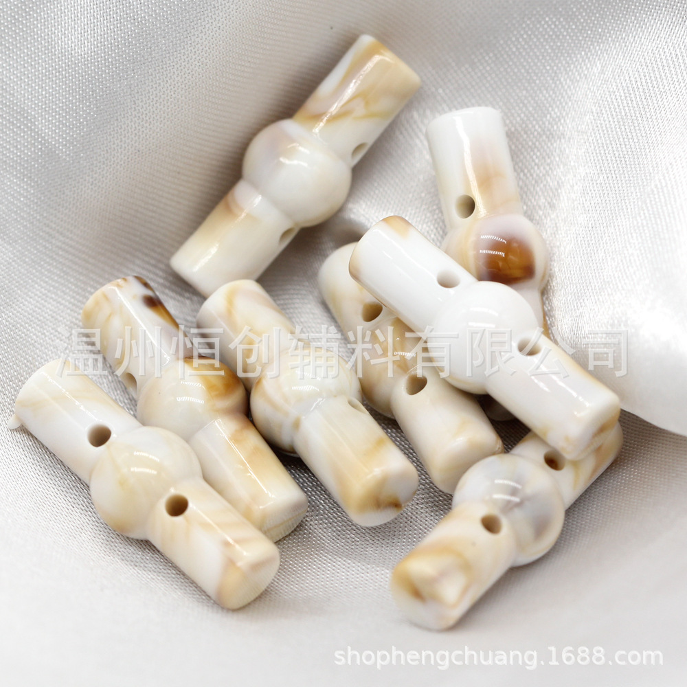 25x9mm brillante Hengchuang botón de resina cilíndrica de dos agujeros botón de estilo nacional suéter de punto botón de color de bricolaje al por mayor