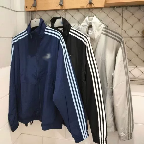 New FIREBIRD three-stripe woven windbreaker jacket with embroidered logo, available in men’s and women’s styles, model KB2466
