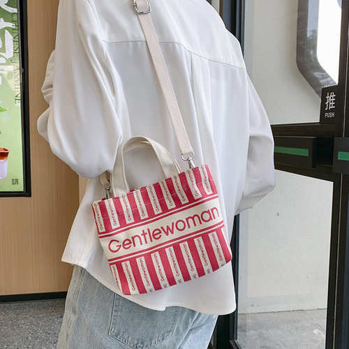 Cross-border wholesale fashion canvas mini shoulder crossbody small bag trendy new striped double-sided letter print handbag