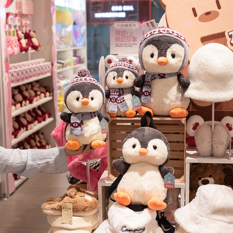 Nuevo creativo lindo invierno muñeca pingüino mochila muñeca de dibujos animados pingüino muñeca de niños almohada agarrar muñeca lote