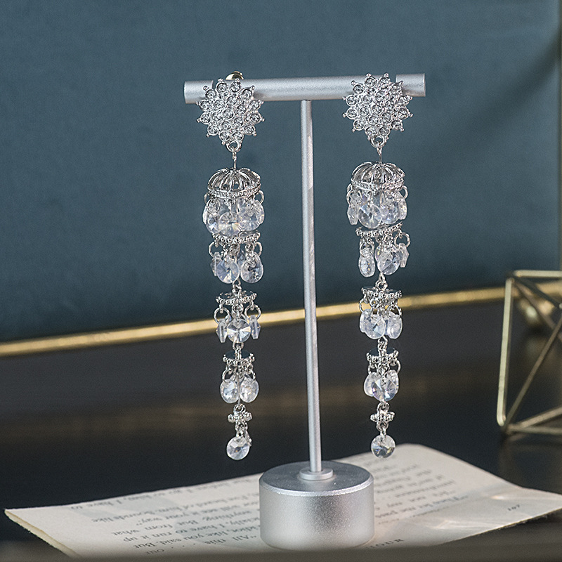 Long elegant three dimensional earrings solar-powered with tassels