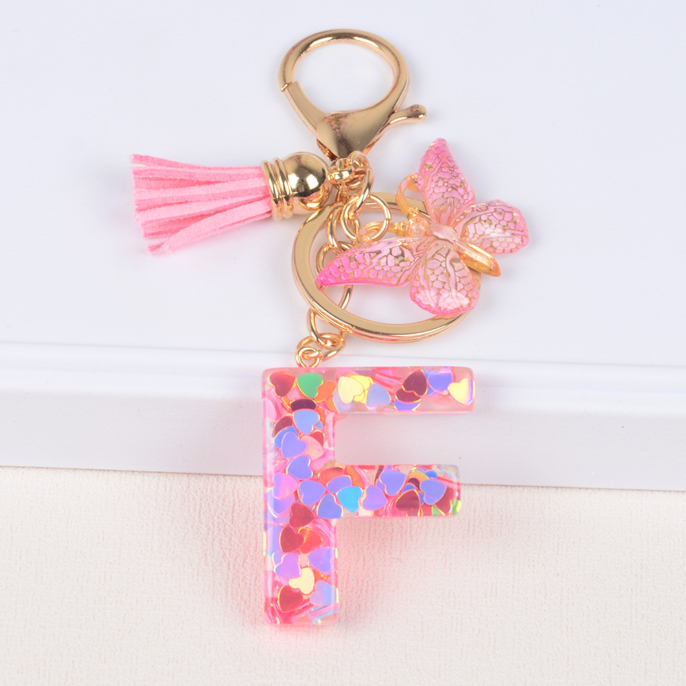 Explosiones transfronterizas amor sequillas iniciales llavero al por mayor resina letra mariposa fringe llavero se puede personalizar