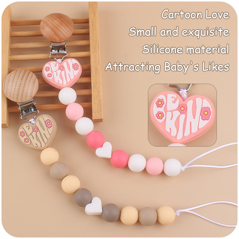 Nuevo bebé de dibujos animados amor mordedor bebé creativo DIY Pequeño amor de silicona mordedura Cadena de pezón cadena anti-caída