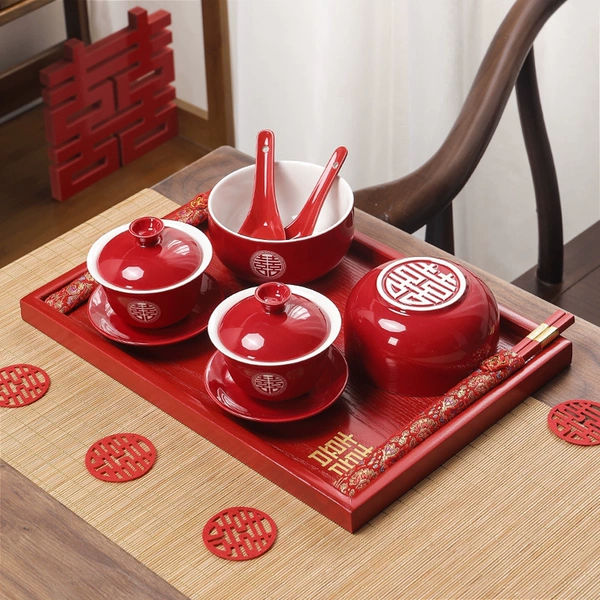A pair of red bowls + matching teacups + square plates