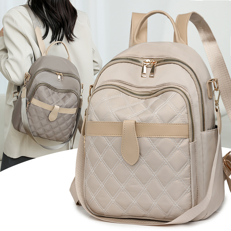 Mochila para mujer 2024 nueva mochila de viaje de ocio de nailon de la moda coreana de todo fósforo