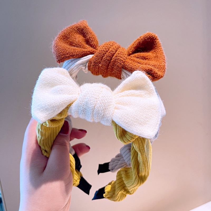 South Korea's Dongdaemun Autumn And Winter New Knitted Bowknot Contrasting Color Headband Western Simple Temperament Pressure Hair Sweet Headband display picture 4