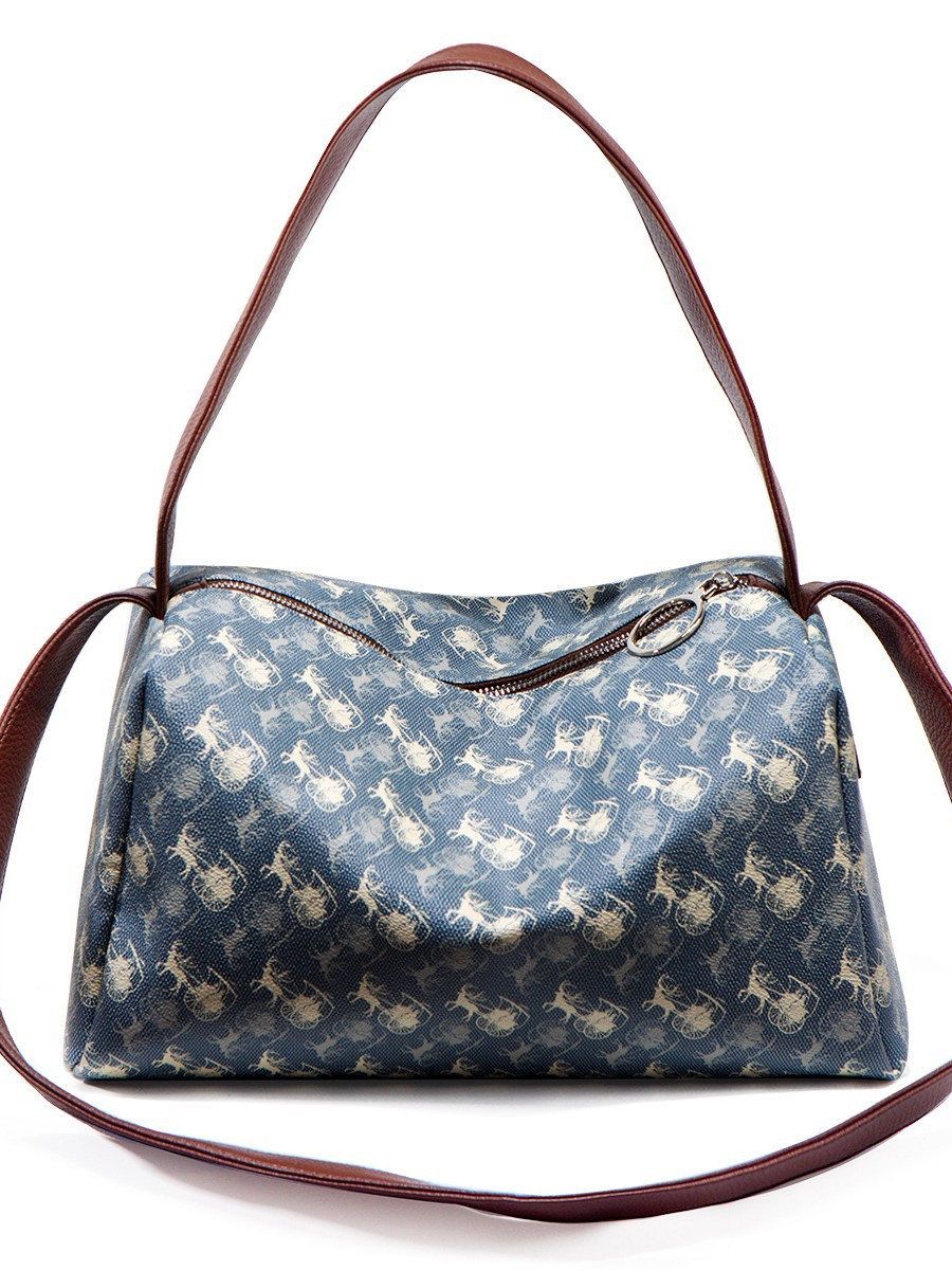 Bolsa impresa de gran capacidad para mujeres 2025 invierno nuevo nicho de textura de alta calidad para viajar mochila de hombro