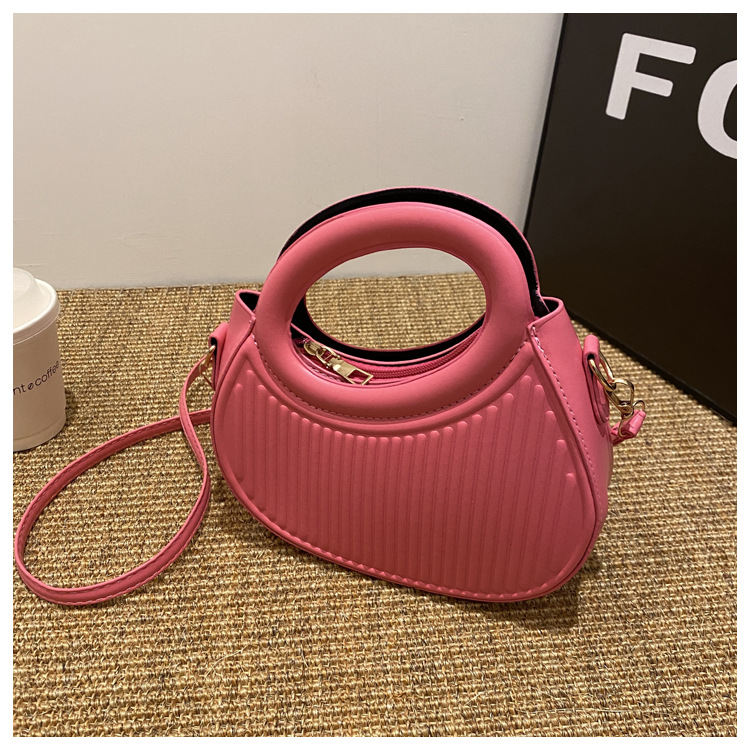 Fresco dulce dopamina color sólido rayas bolso de las mujeres este año popular pu estilo occidental bolso de hombro redondo