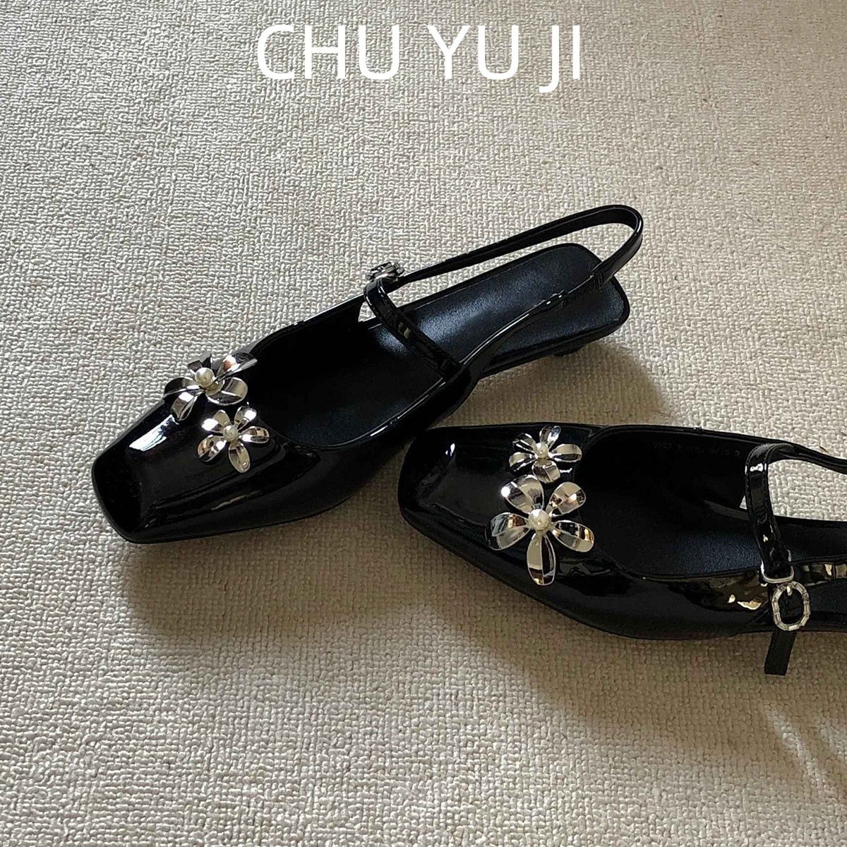 Elegant black sandals with rhinestones with a strap