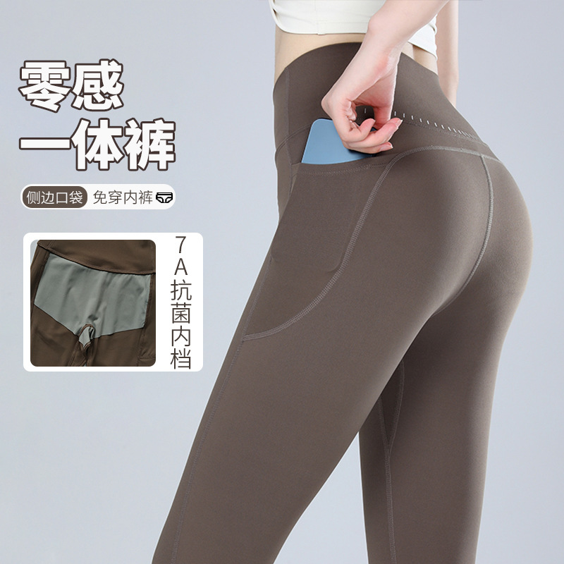 Pantalones de fitness desnudos para mujeres sonrientes líneas de elevación de cadera pantalones deportivos para mujeres al aire libre cintura alta sin marcas nueve puntos pantalones de calzado