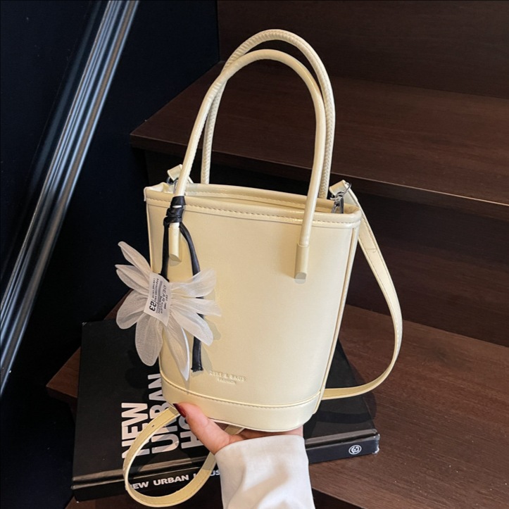 Bolso de moda personalizado bolso de cubo de textura de color sólido 2025 nuevo bolso de hombro de color sólido casual bolso de mensajero de cercanías