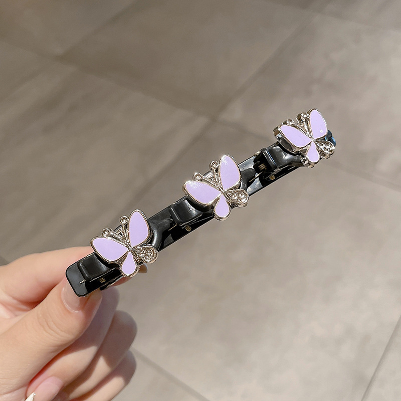 22 # Mariposa púrpura.