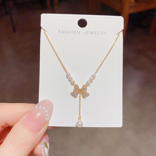 Sweet niche light luxury jewelry women's new bow pearl necklace pendant clavicle chain sweater chain