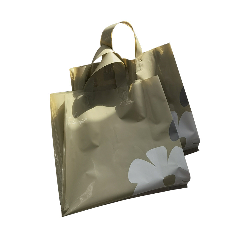 批发山茶花简约素雅塑料手提袋服装店用礼品袋春夏清新装衣服袋子