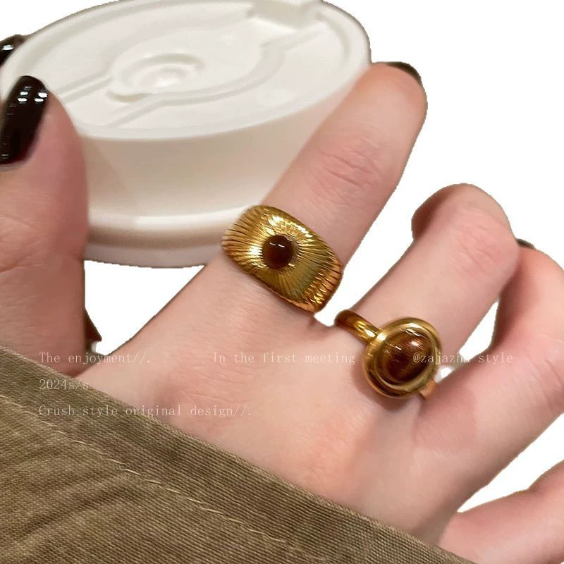 Golden small design ring with stone solar-powered, high-end