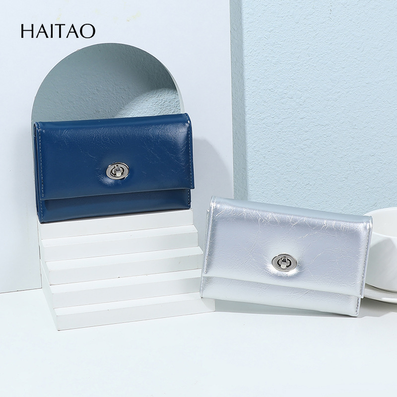 Nuevo tipo de billetera de mujer transfronteriza tres plegables cera de aceite billetera de cuero de gran capacidad multi-tarjeta de alta calidad billetera de cambio para mujeres