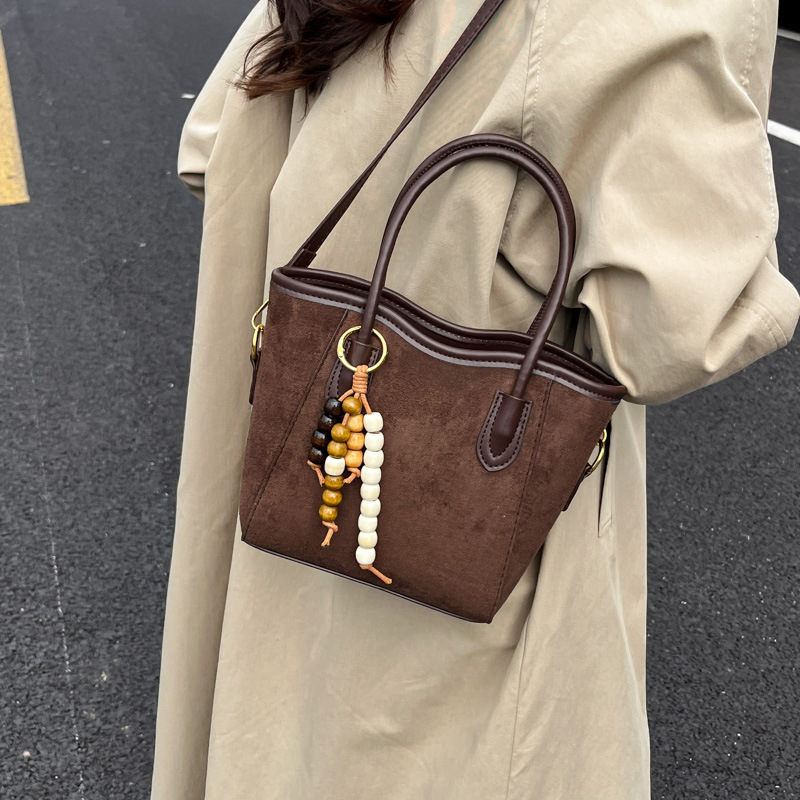 2025 otoño y invierno nuevo bolso de alta calidad bolso de cubo de agua universal bolso de hombro popular de mujer retro mochila esmerilado