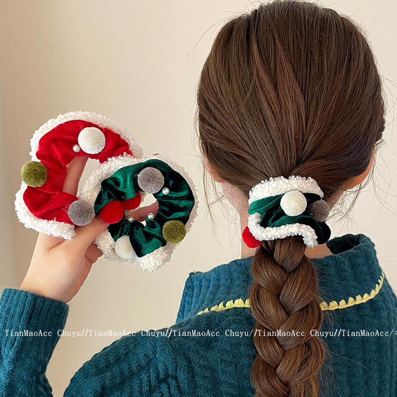 クリスマスの赤い緑の毛玉の大腸の髪の輪の女性は髪の毛の紐を刺します。|undefined