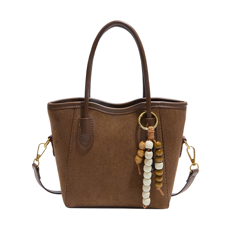 2025 otoño y invierno nuevo bolso de alta calidad bolso de cubo de agua universal bolso de hombro popular de mujer retro mochila esmerilado